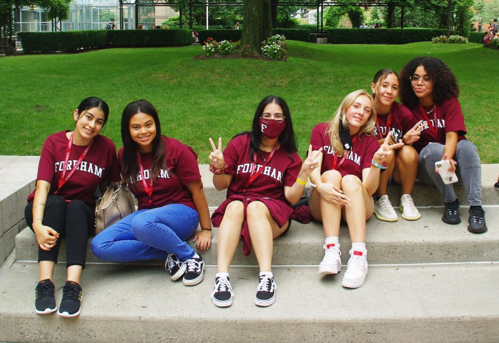 Fordham students posing on steps at Lincoln Center Campus
