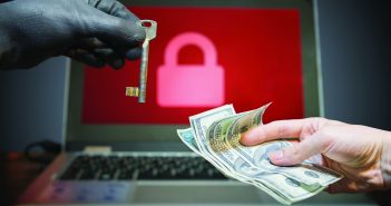 What is Ransomware? Computer security and hacking concept. Ransomware virus has encrypted data in laptop. Hacker is offering key to unlock encrypted data for money.