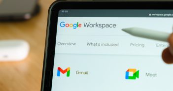 Updates from Google Google Workspace logo shown by apple pencil on the iPad Pro tablet screen. Man using application on the tablet. December 2020, San Francisco, USA