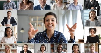 Webcam laptop screen view many faces of diverse people involved in group videoconference on-line meeting lead by indian businesswoman leader, team using video call app work solve common issues concept