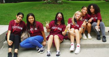 Fordham students posing on steps at Lincoln Center Campus